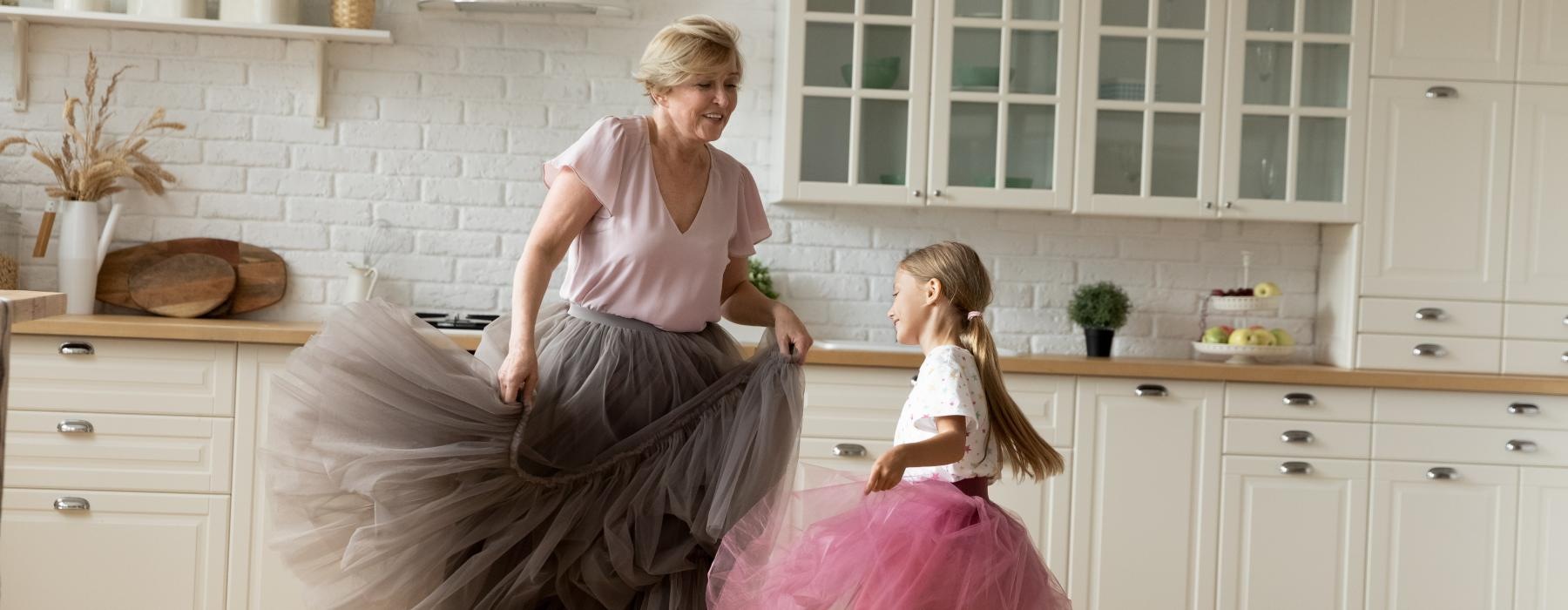 a woman and a child in a kitchen